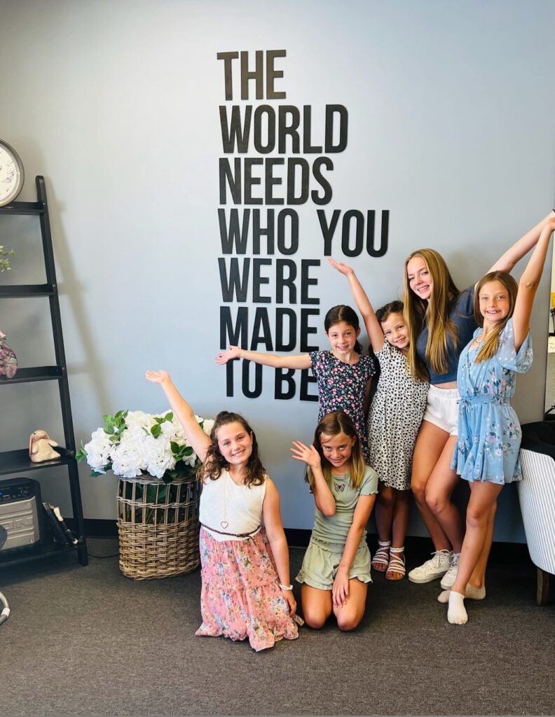 Girls celebrating that they are valued in the world. Building real confidence in teens