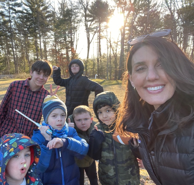 Maria outside with the Fearless Focus boys having fun. This is the boys program focused on social-emotional growth.